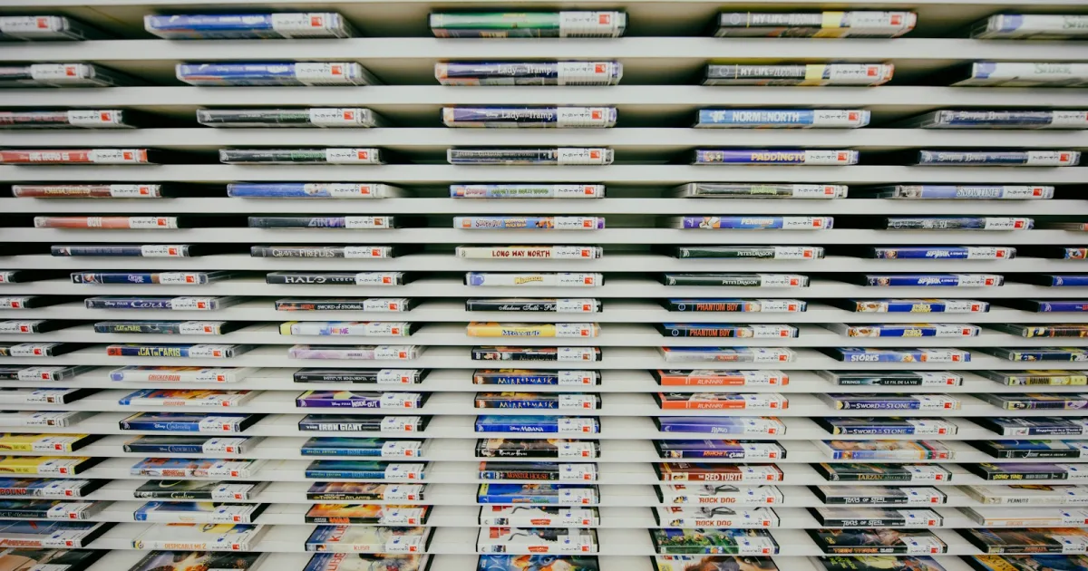 Rows of physical video game cases displayed on a store shelf