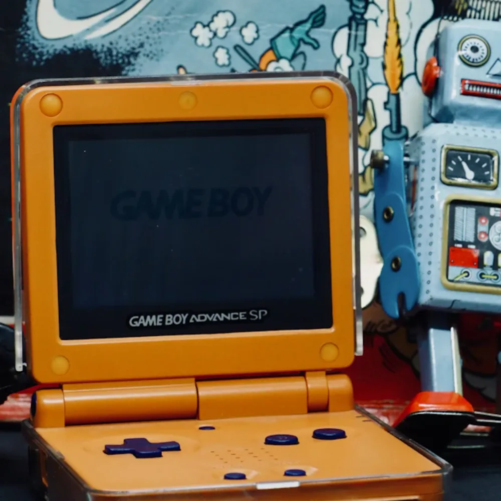 Rebuilt Game Boy Advance SP handheld in an orange Ember shell