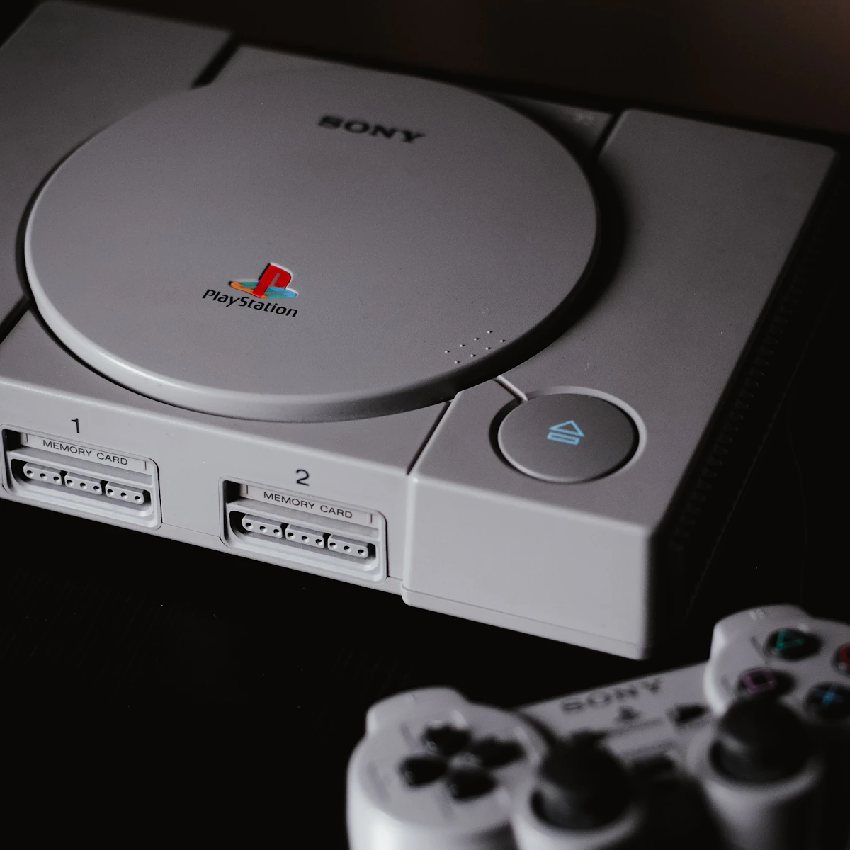 Restored original PlayStation console with controller